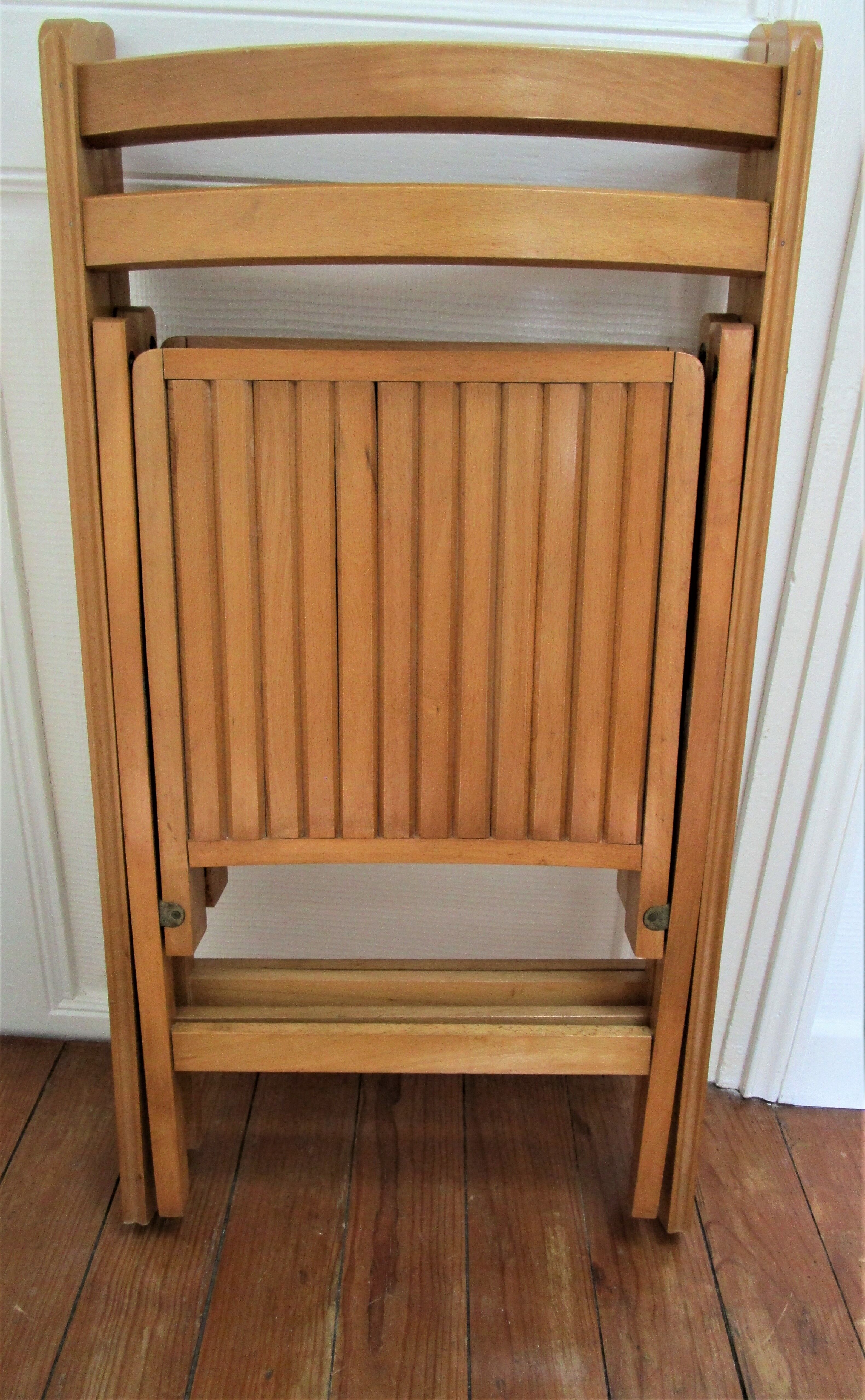 Pair of folding chairs with vintage solid wood slats