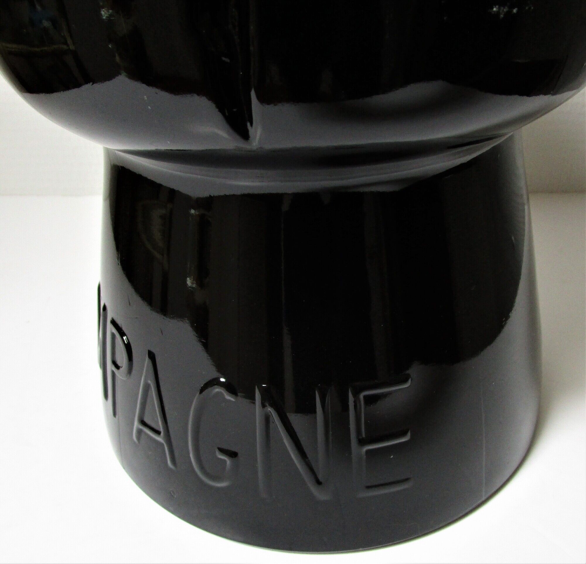 Champagne bucket design black glass in the shape of a 70s cork