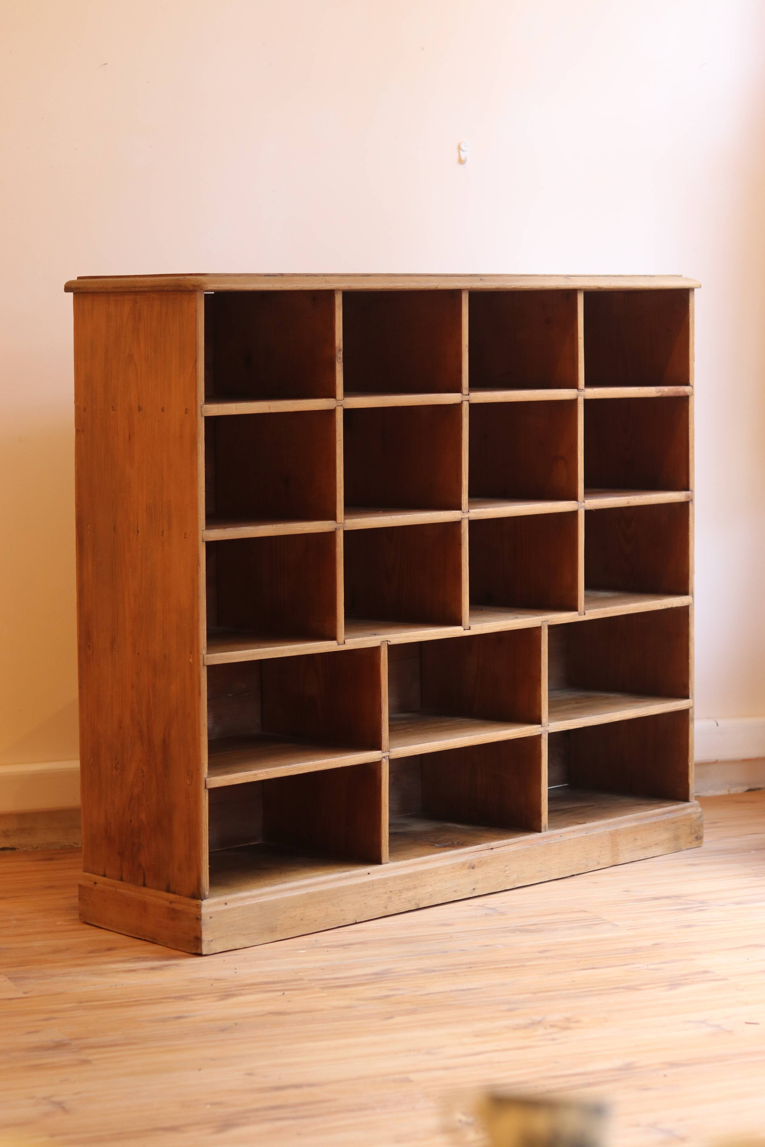 Large storage unit with compartments in waxed pine, early 20th century.