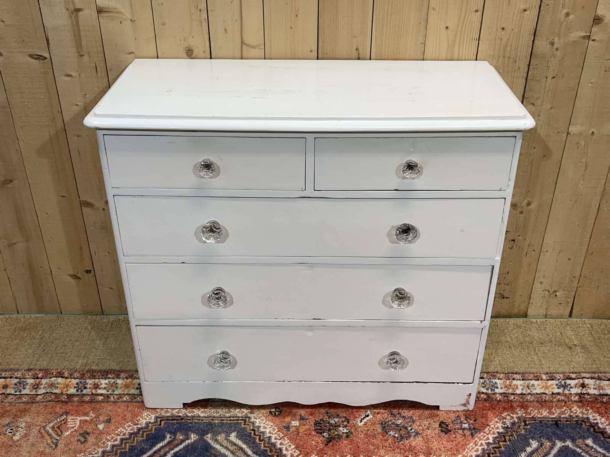English chest of drawers painted in fir with glass knobs, 19th century