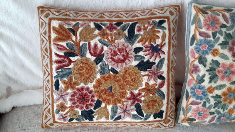Set of three old hand-embroidered wool cushions