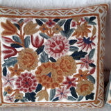 Set of three old hand-embroidered wool cushions