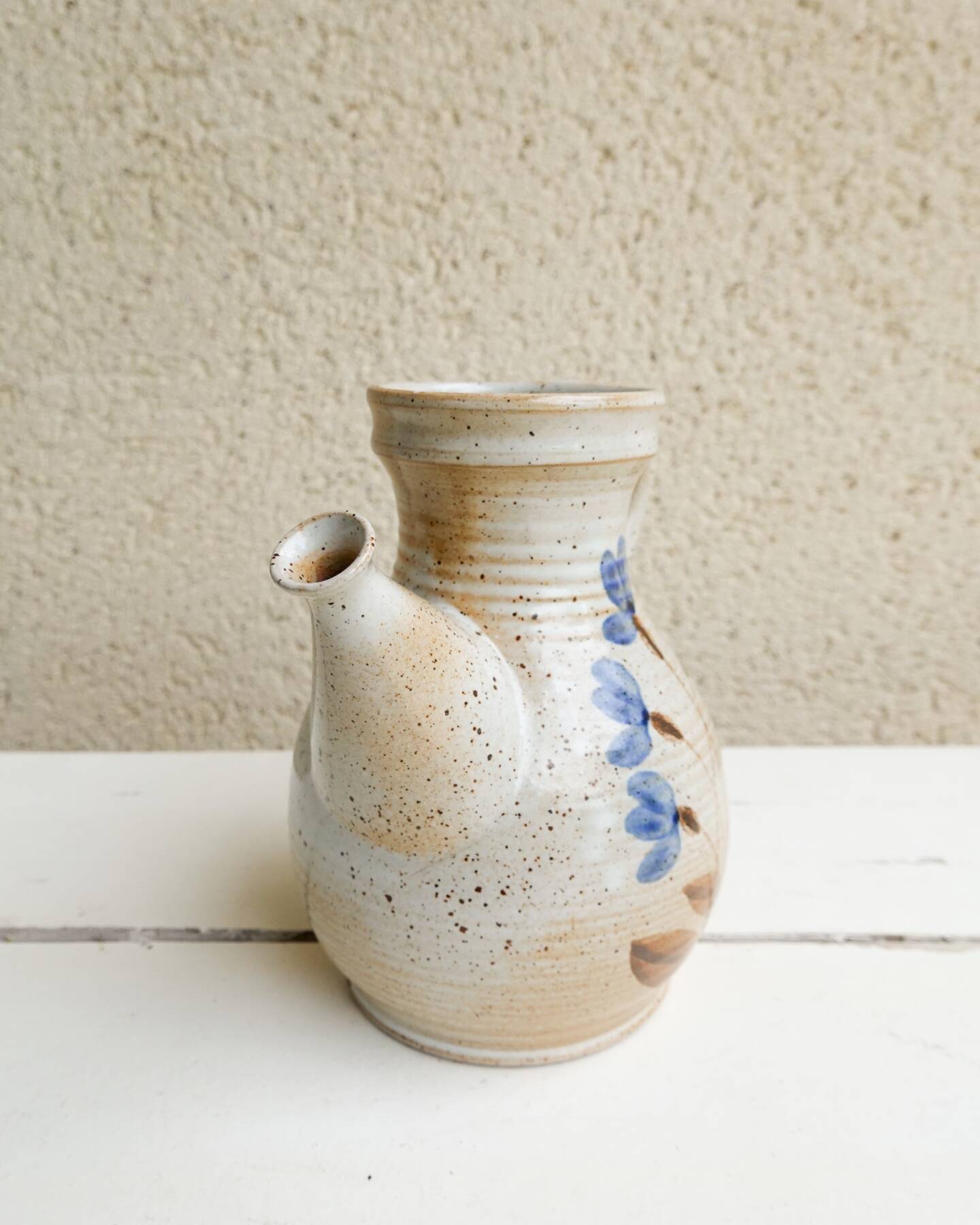 Marais stoneware pitcher, floral decoration