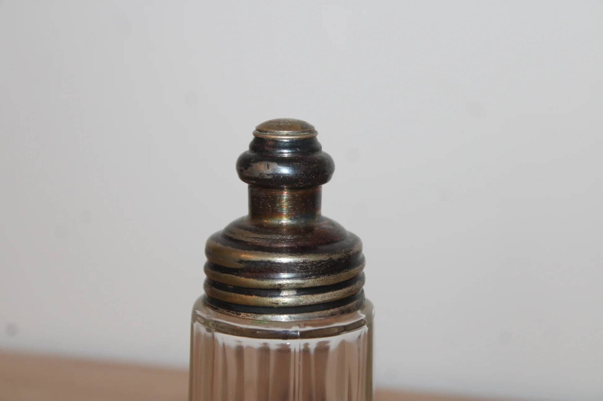 Vintage striped glass and patinated metal oil serving utensil.