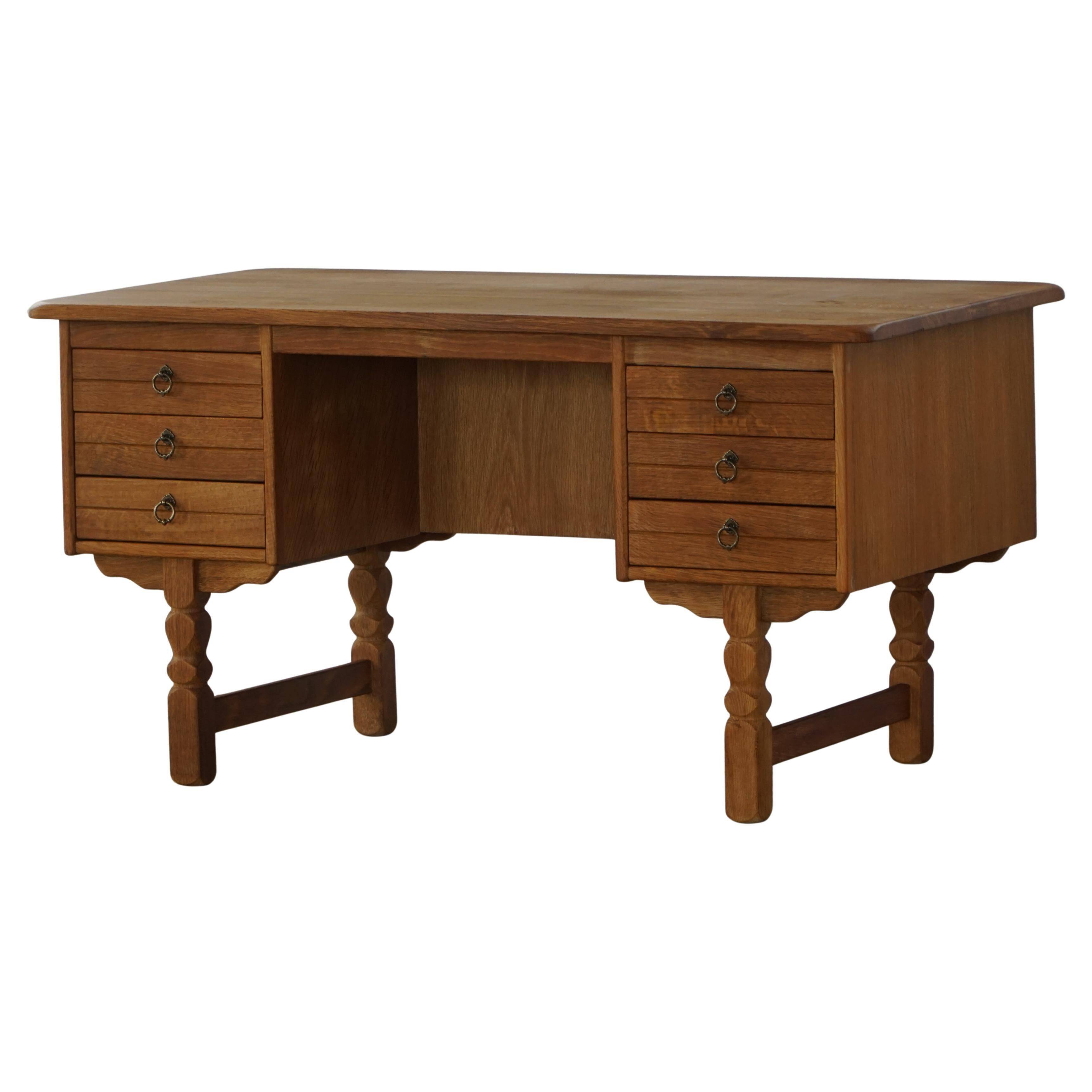 Free-standing desk in Oak by Henning Kjærnulf, Mid-century Danish Modern, 1950s.
