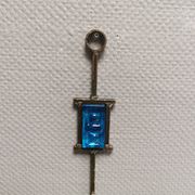 Wall-mounted candle holder in cast iron and hard pressed blue glass.