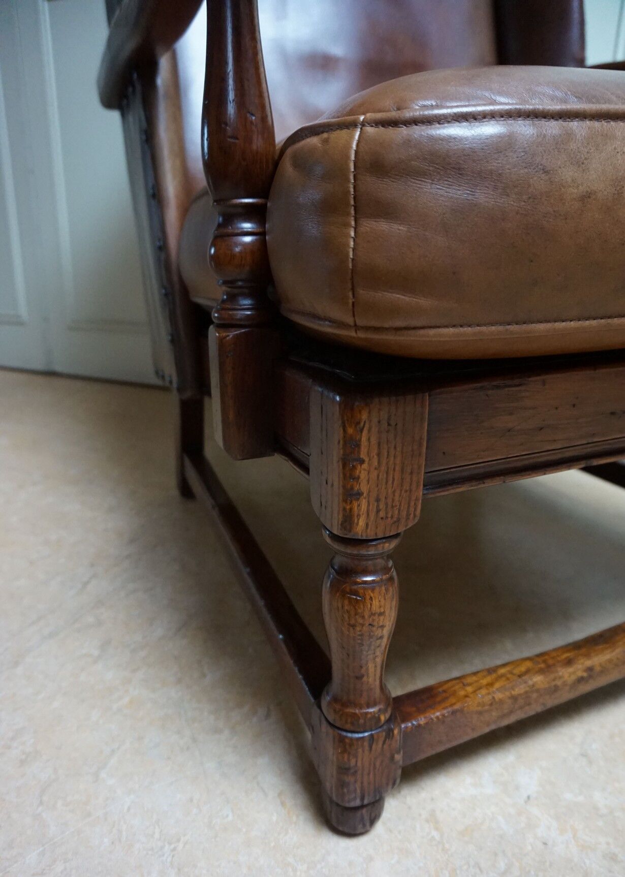 English high back cognac leather wingchair by Criterion cord