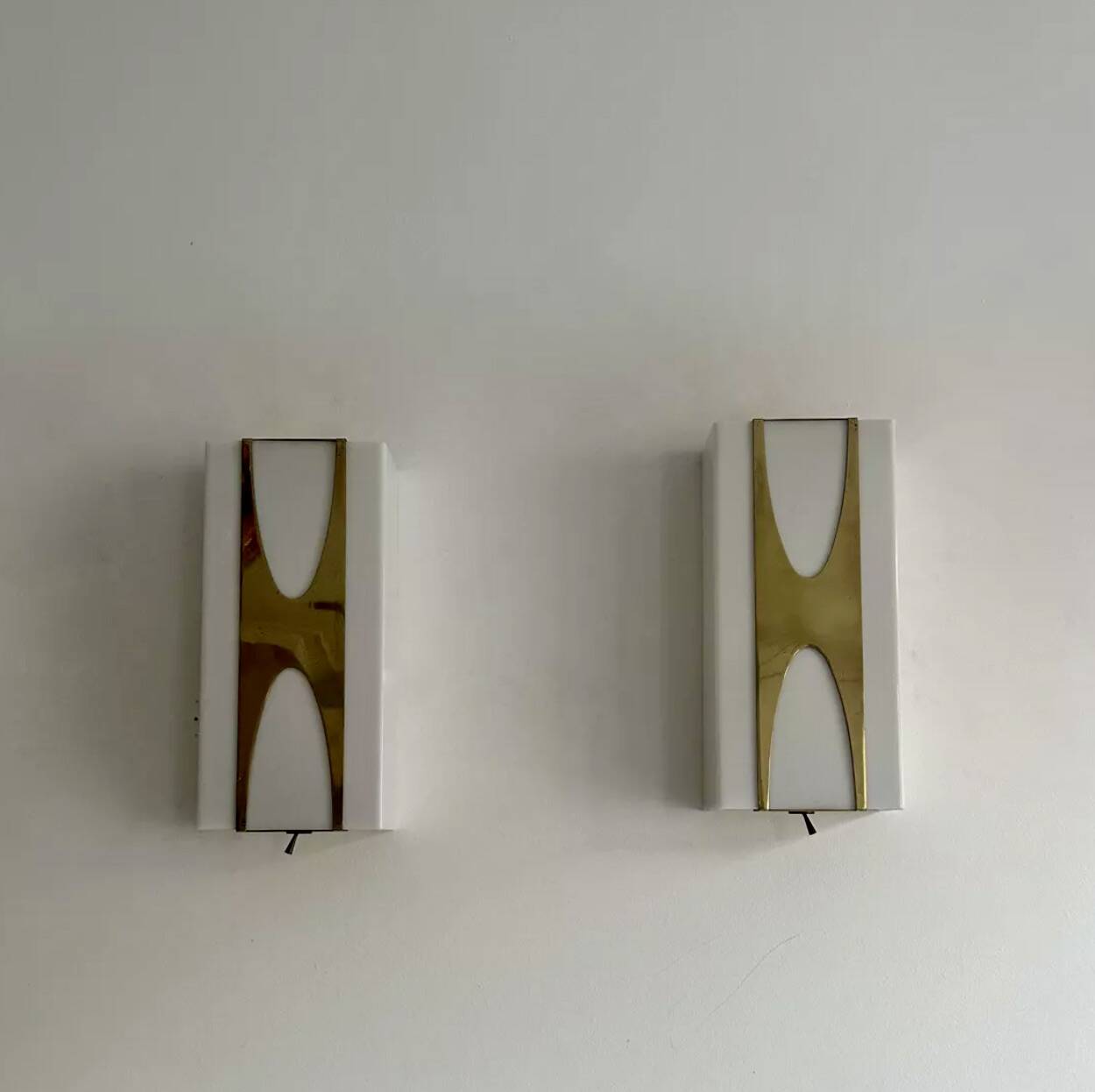 Pair of Loewy wall lights for Hilton, brass and Perspex, France 1965