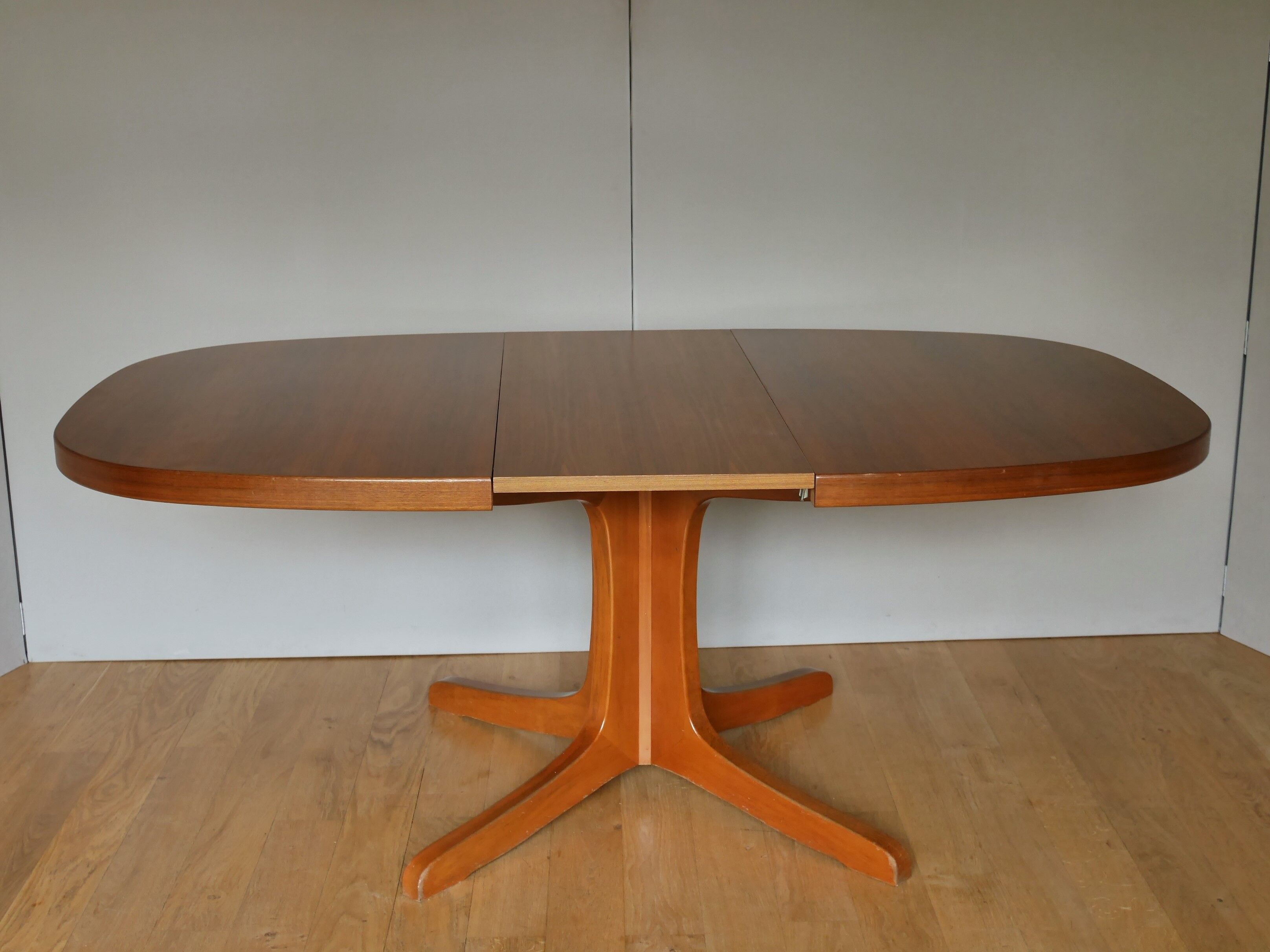 Baumann oval walnut table with extension cords