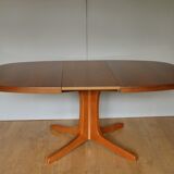 Baumann oval walnut table with extension cords
