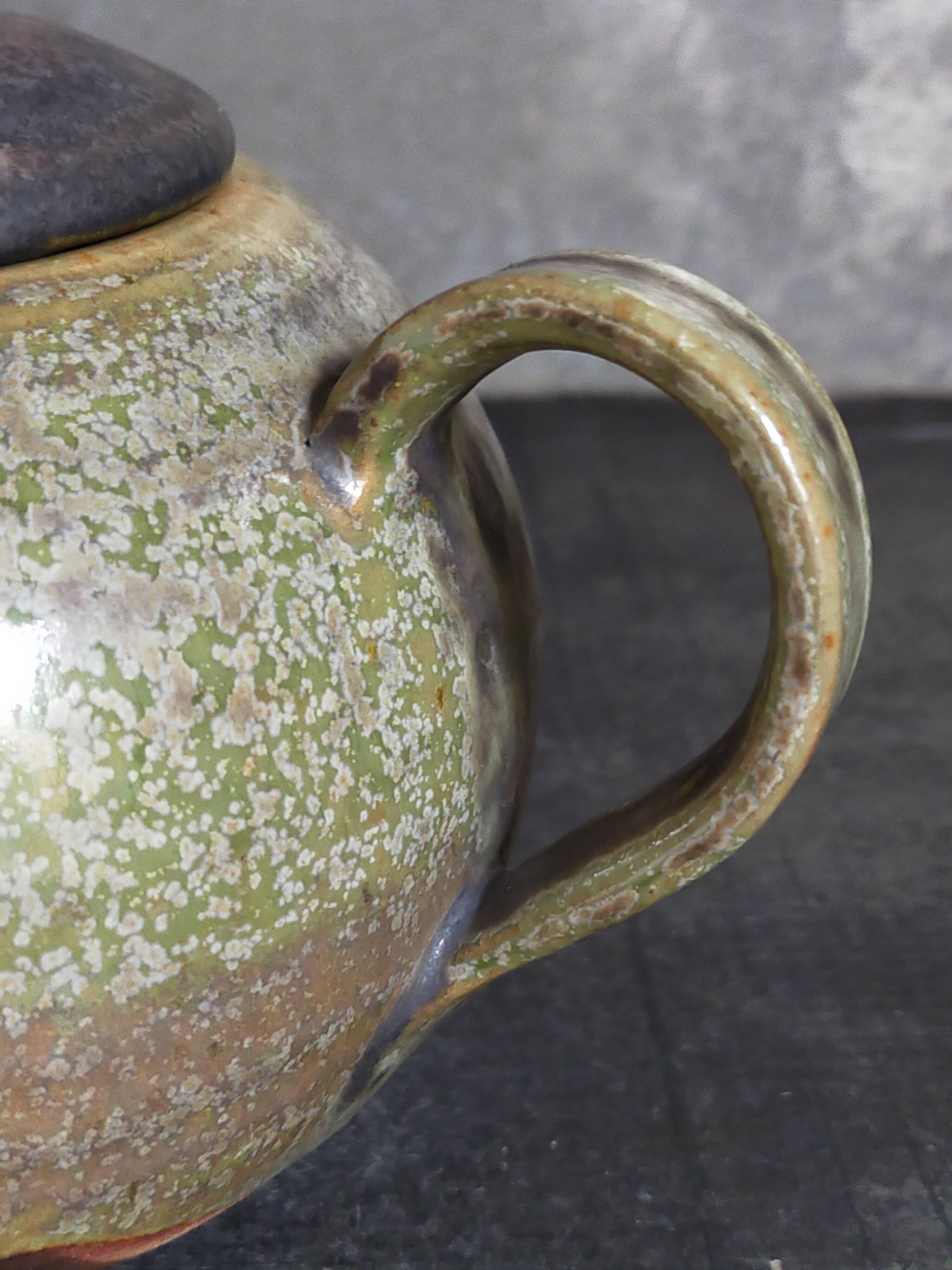 Vintage enameled stoneware potter's teapot