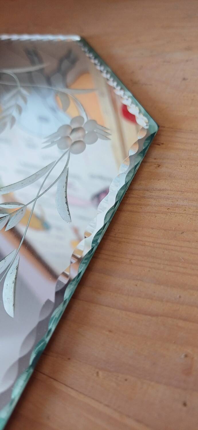 Beveled mirror with floral decor