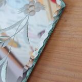 Beveled mirror with floral decor