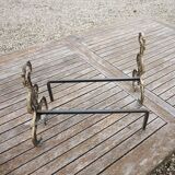 Antique brass andirons with lion decoration