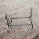 Antique brass andirons with lion decoration