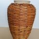 Rattan vase on ceramic