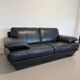 Two-seater Natuzzi sofa in navy blue leather.