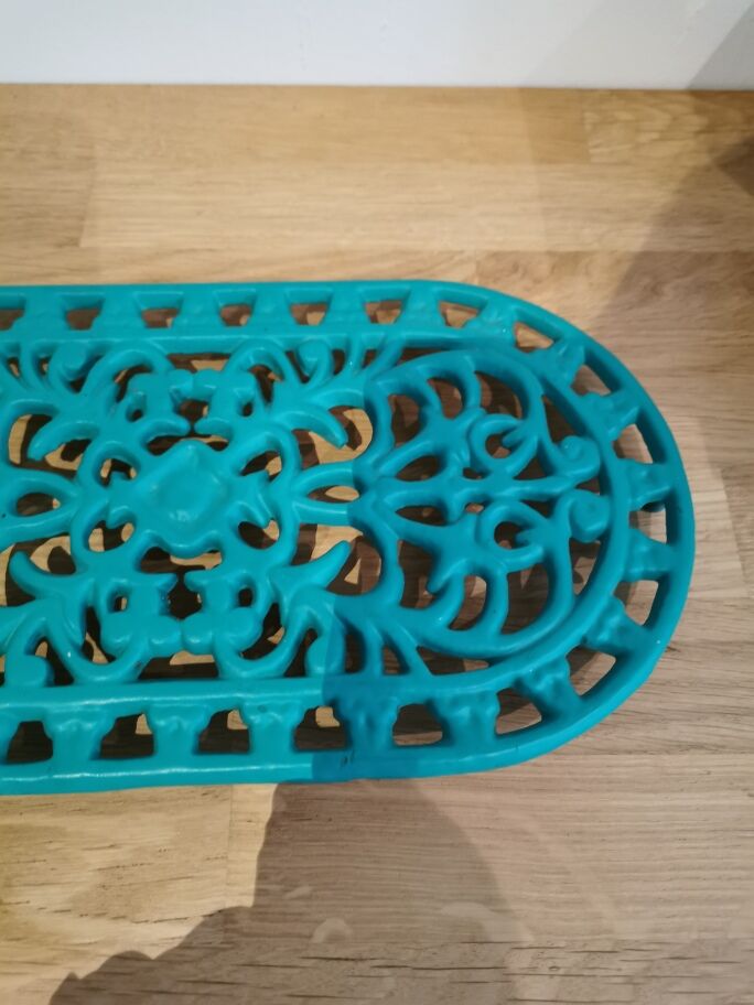 underside of the cast iron dish painted blue