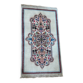 Tapis d’Orient fait mains en pure laine vierge motifs floraux richement colorés