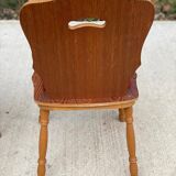 2 curved wood and red fabric chairs