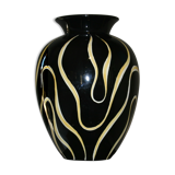 Black ceramic vase and yellow flames