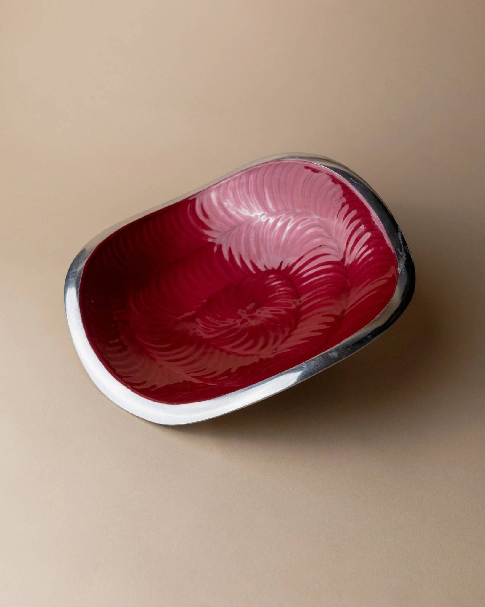 Red enameled steel bowl with textured interior and silver exterior; vintage Italian 1970s design