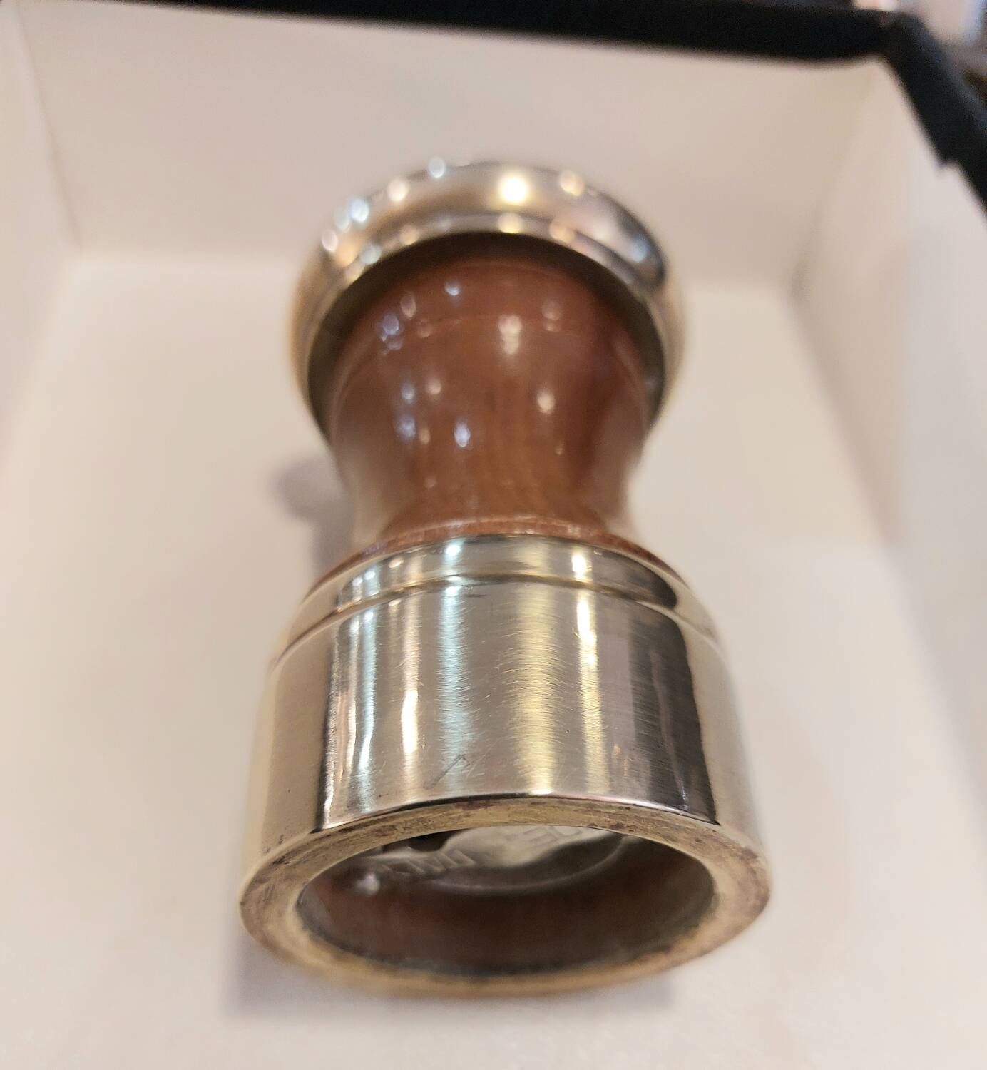 Varnished wood and brushed brass pepper mill