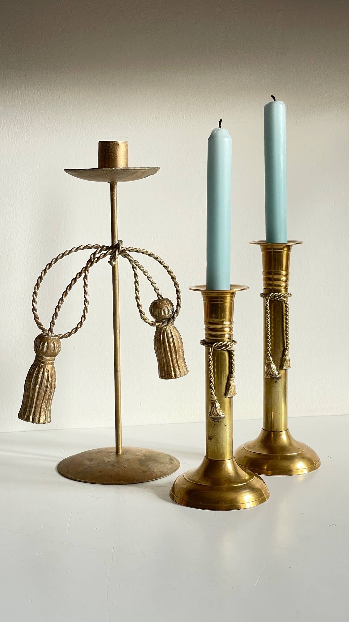 Trio of vintage knotted candlesticks brass