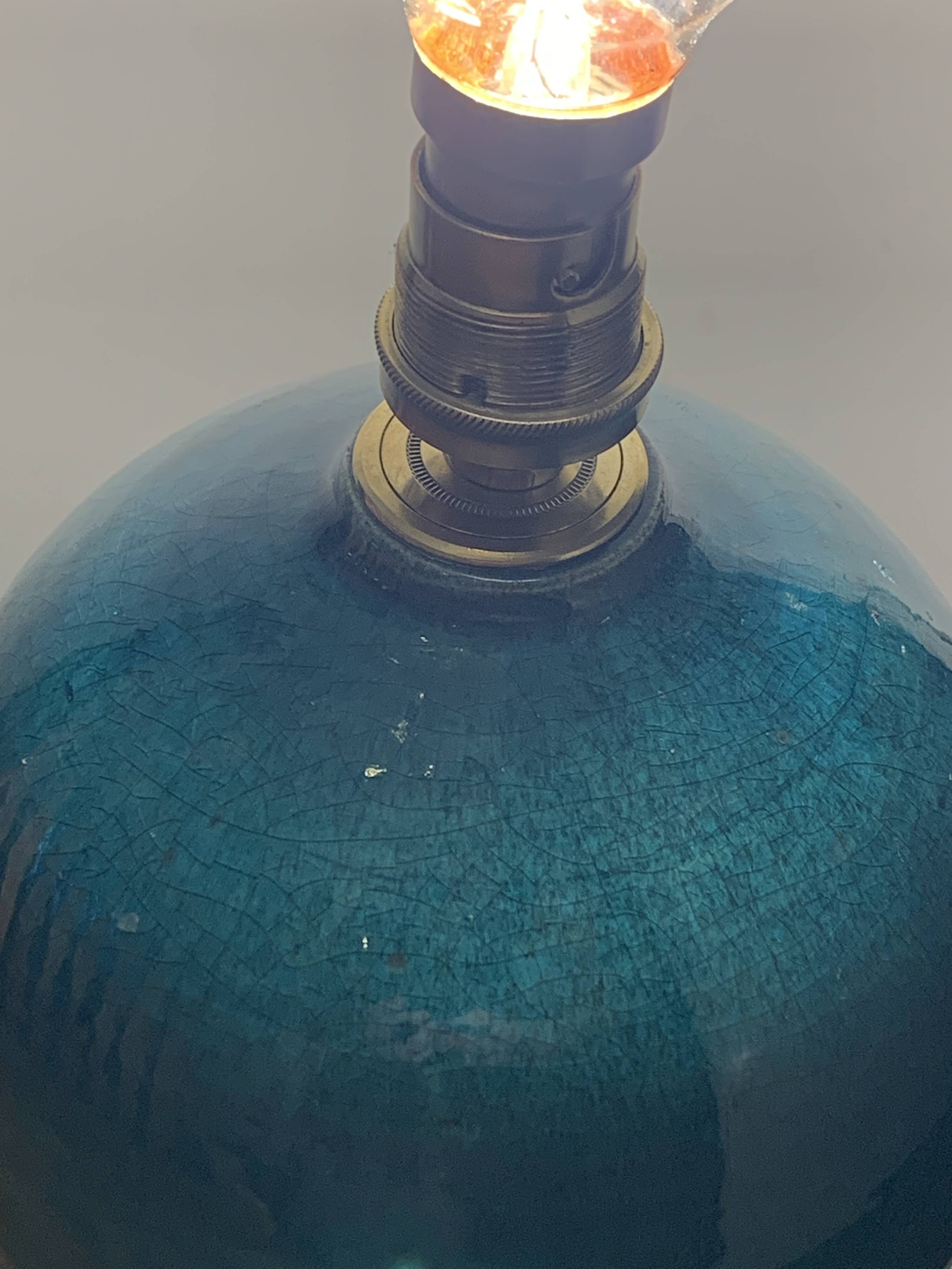 Ball lamp base in cracked ceramic and signed blue green