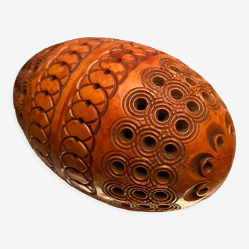 Corozo egg box with richly carved decoration