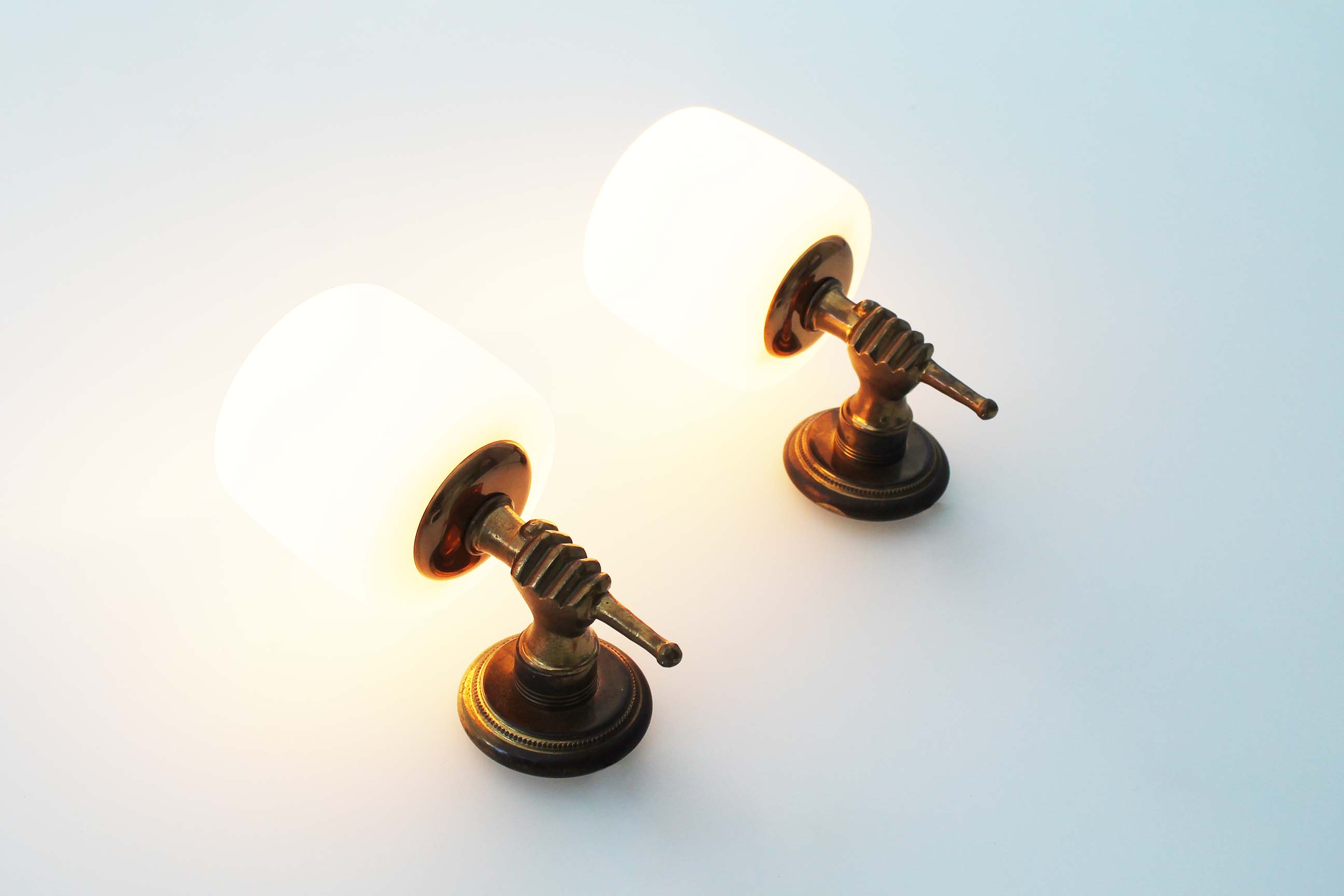 Pair of 1950’s solid brass ‘torch holding hand’ wall sconces by maison arlus
