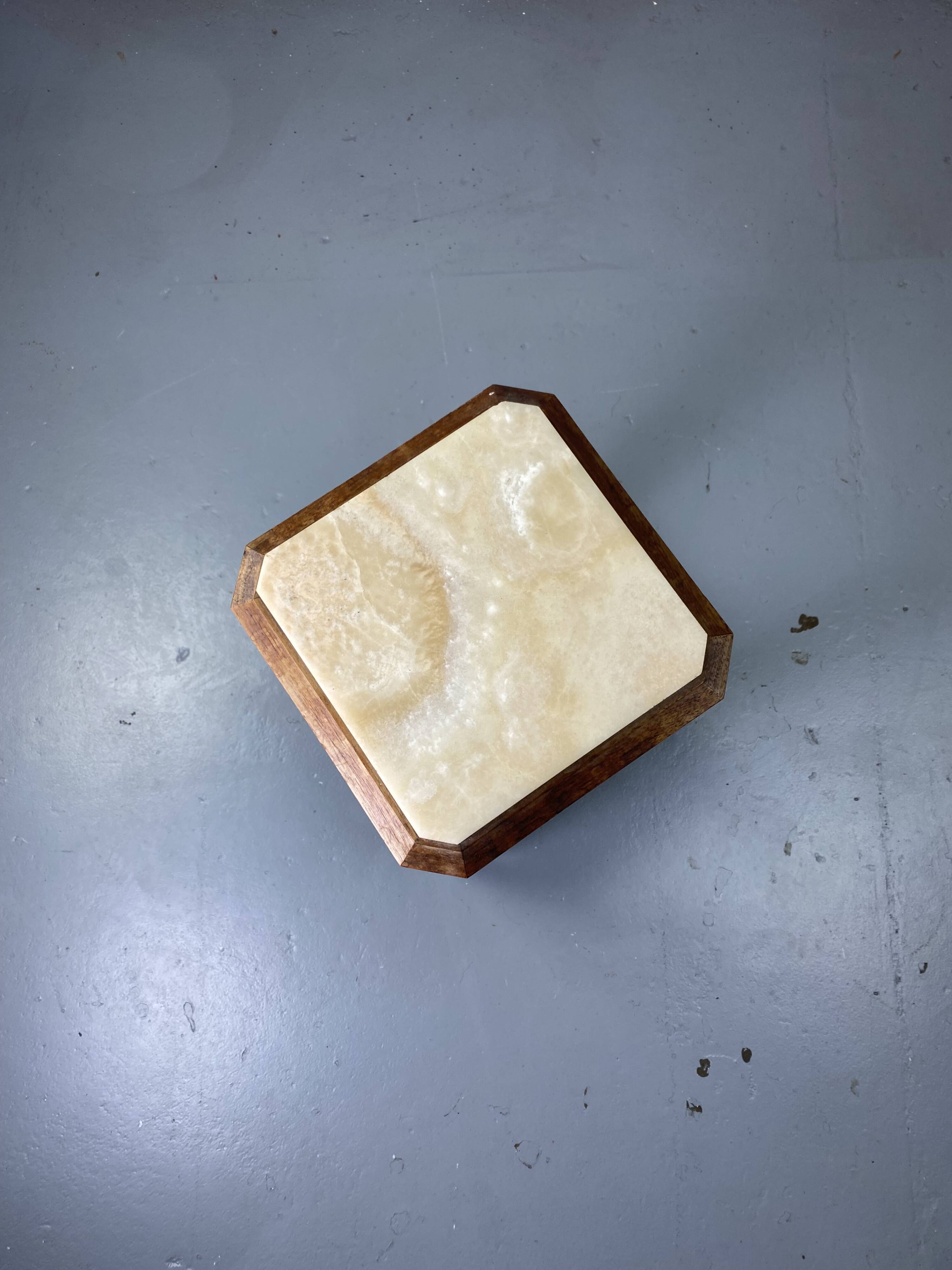 Wooden stool with marble top