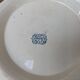 Shallow round plate Boch Frères model Regent with arabesque and foliage decoration.