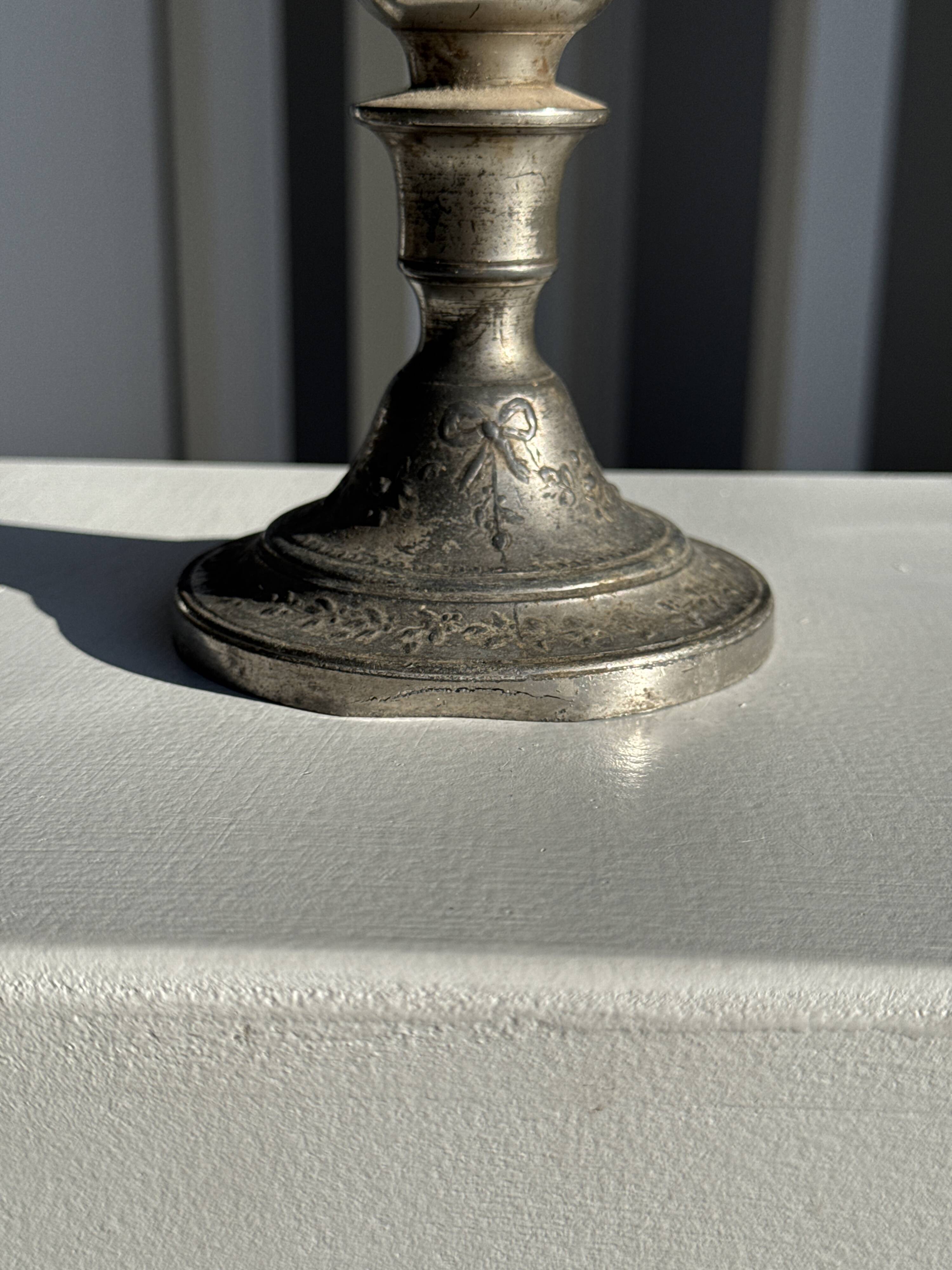 Small antique candle holder engraved in silver-plated metal, in its original condition.