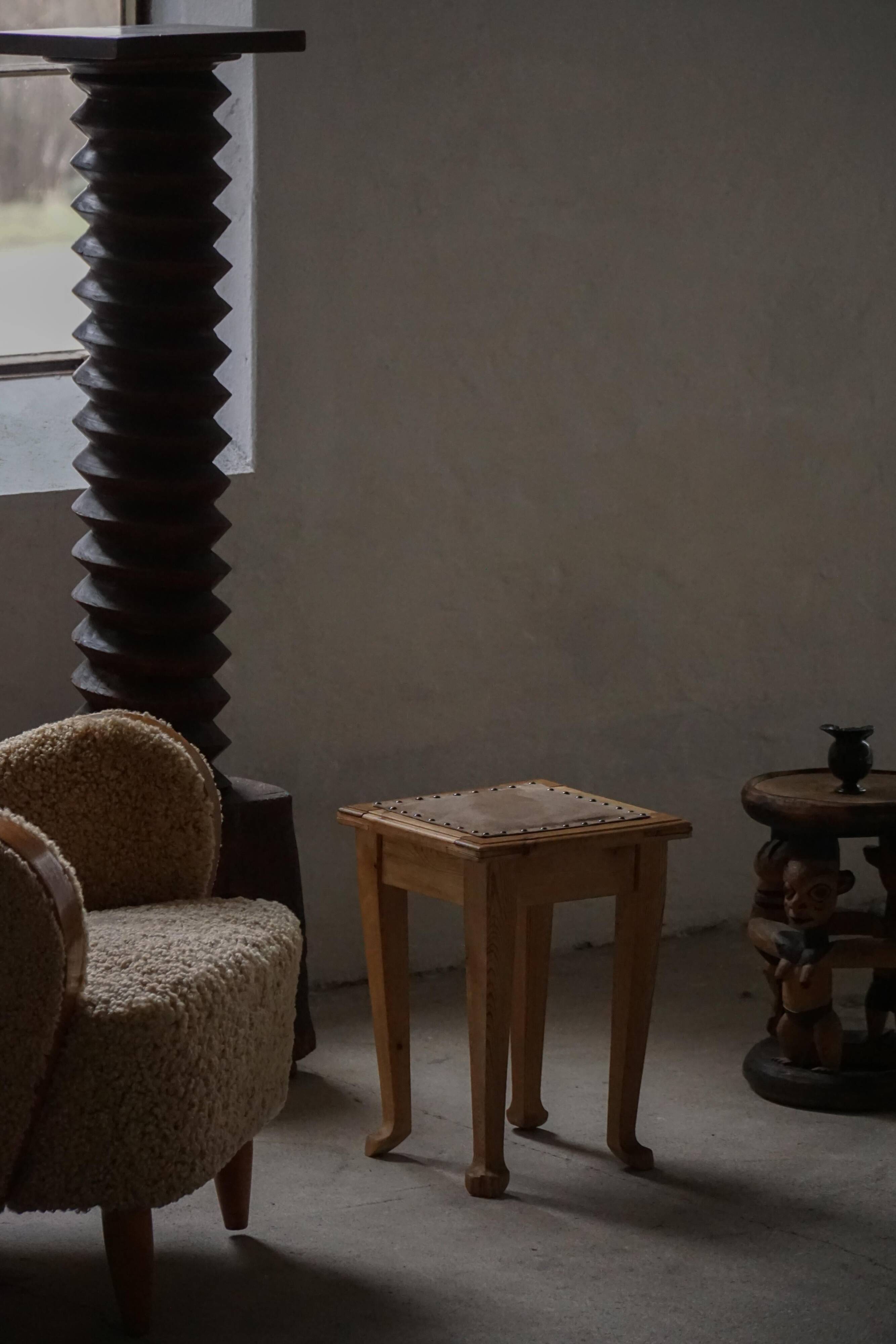 A pair of antique Danish pine stools from the late 19th century.