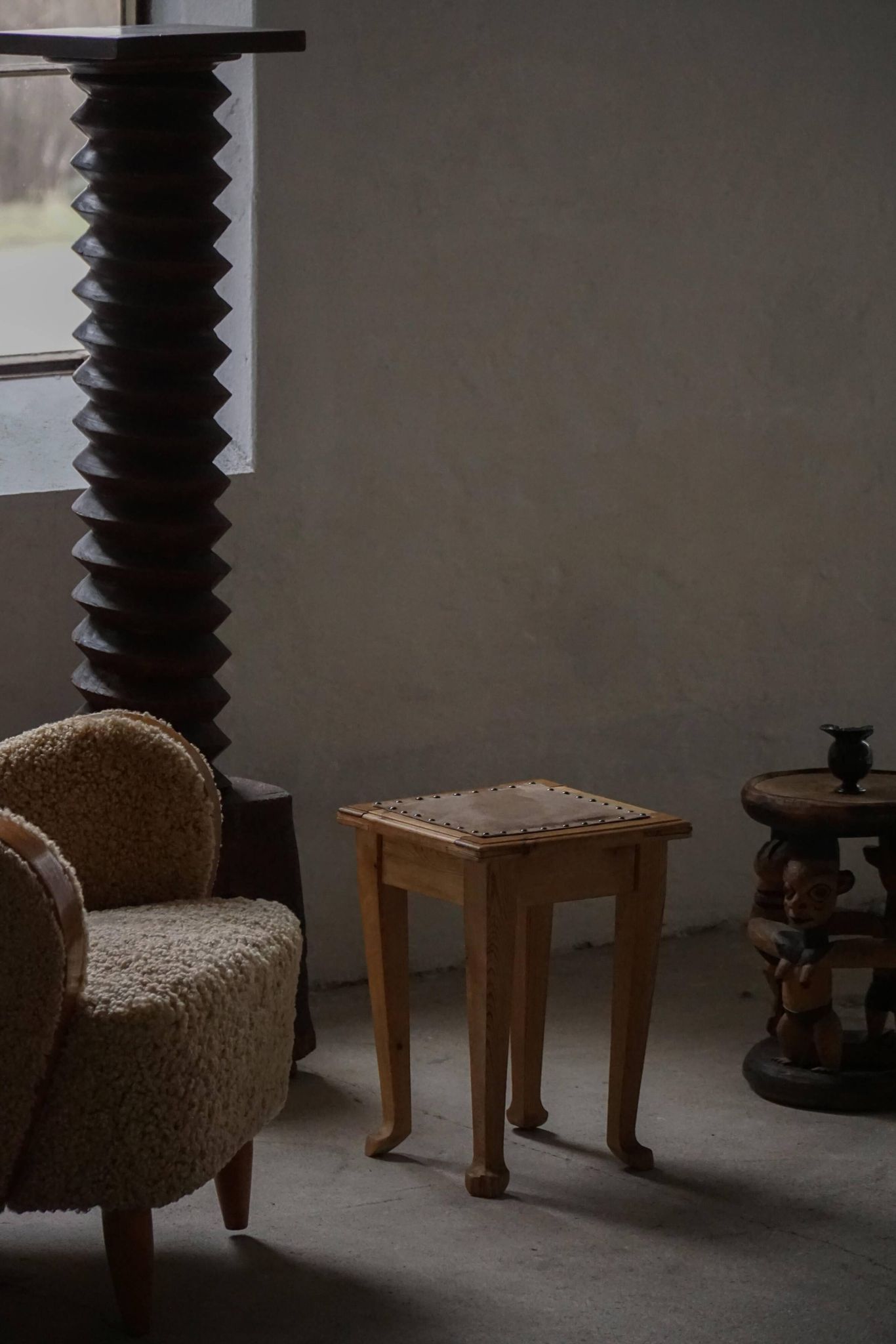 A pair of antique Danish pine stools from the late 19th century.