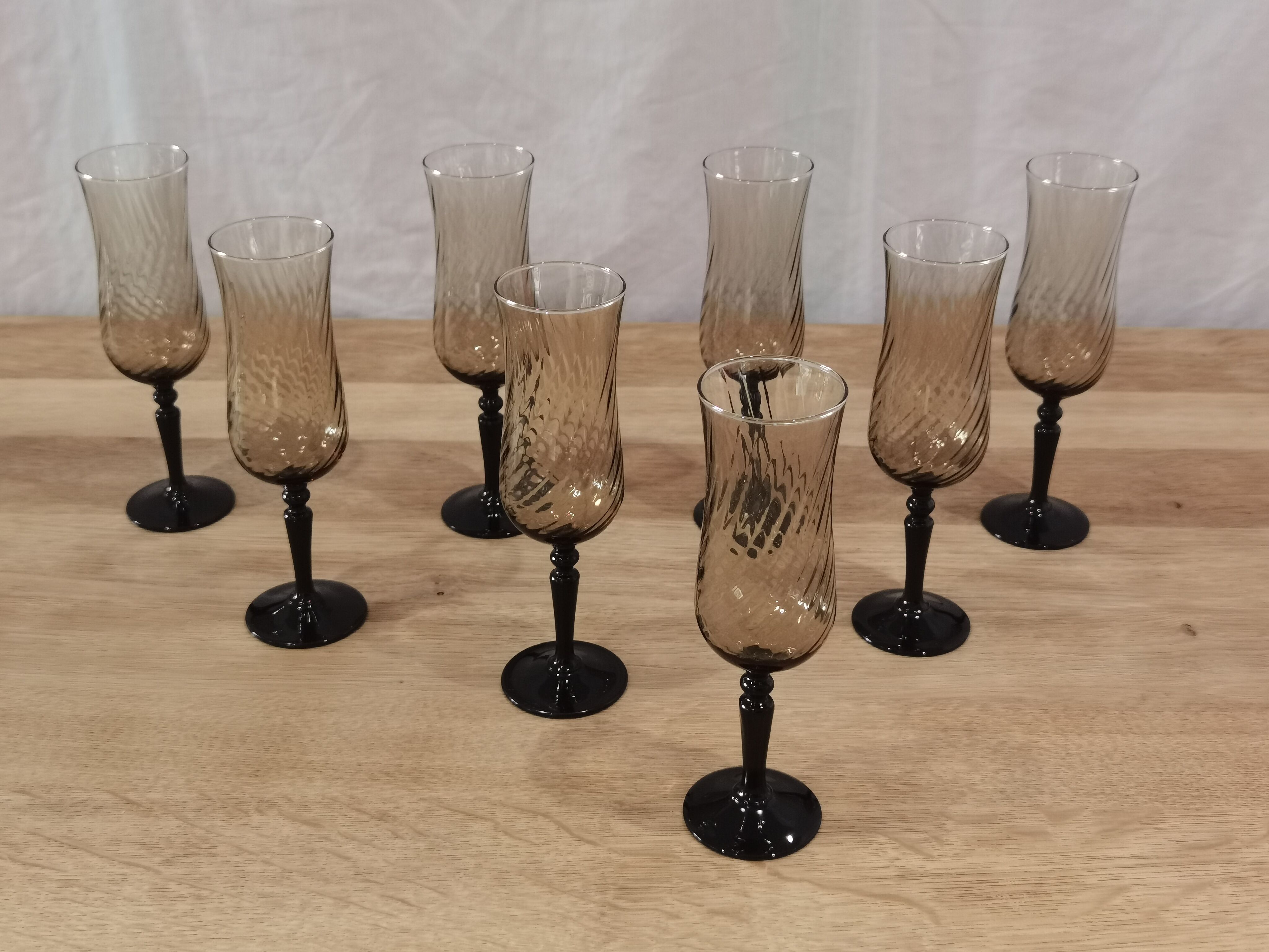 8 vintage smoked champagne flutes with black feet Arcoroc