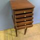 Louis XVI bedside table in mahogany with five drawers.
