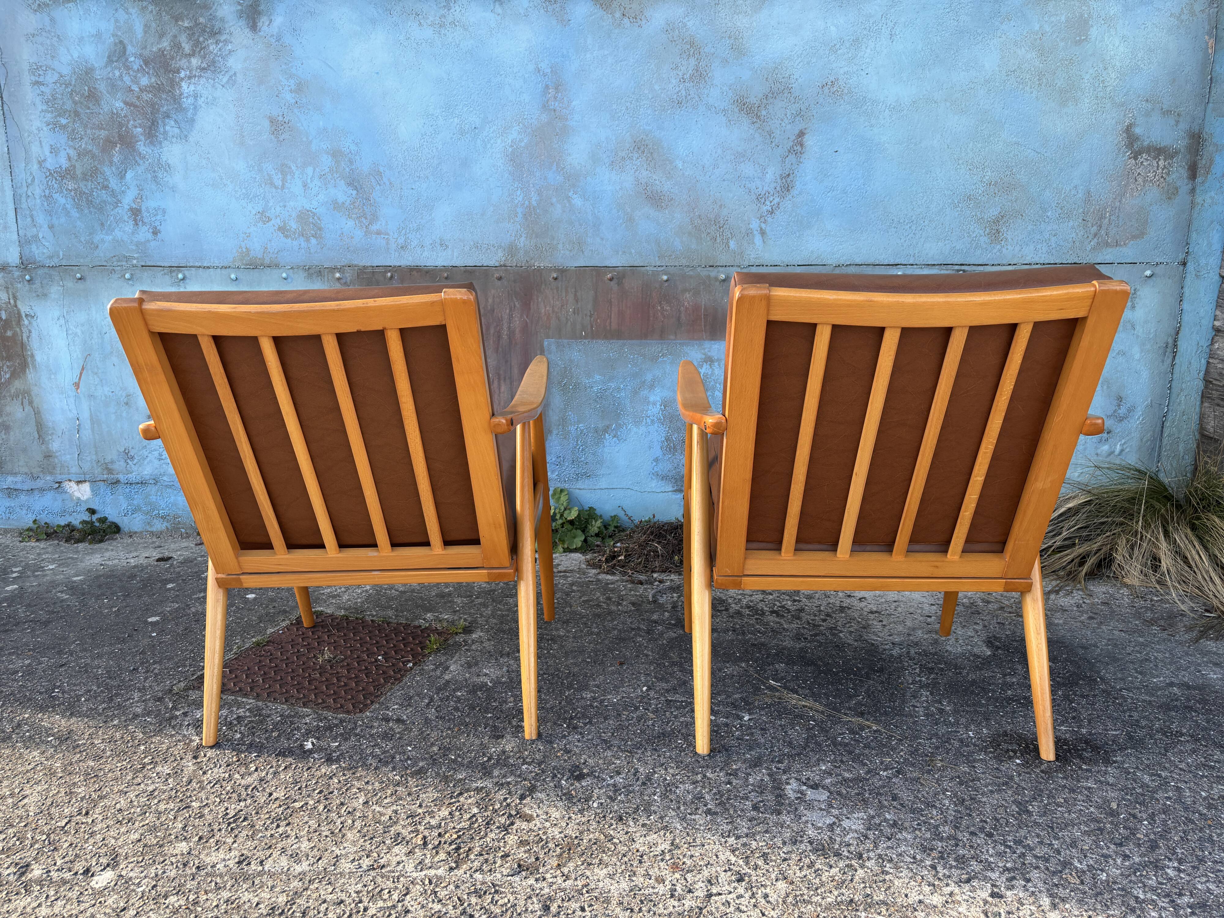 Pair of vintage armchairs with compass legs, "Boomerang" model by THO editions.