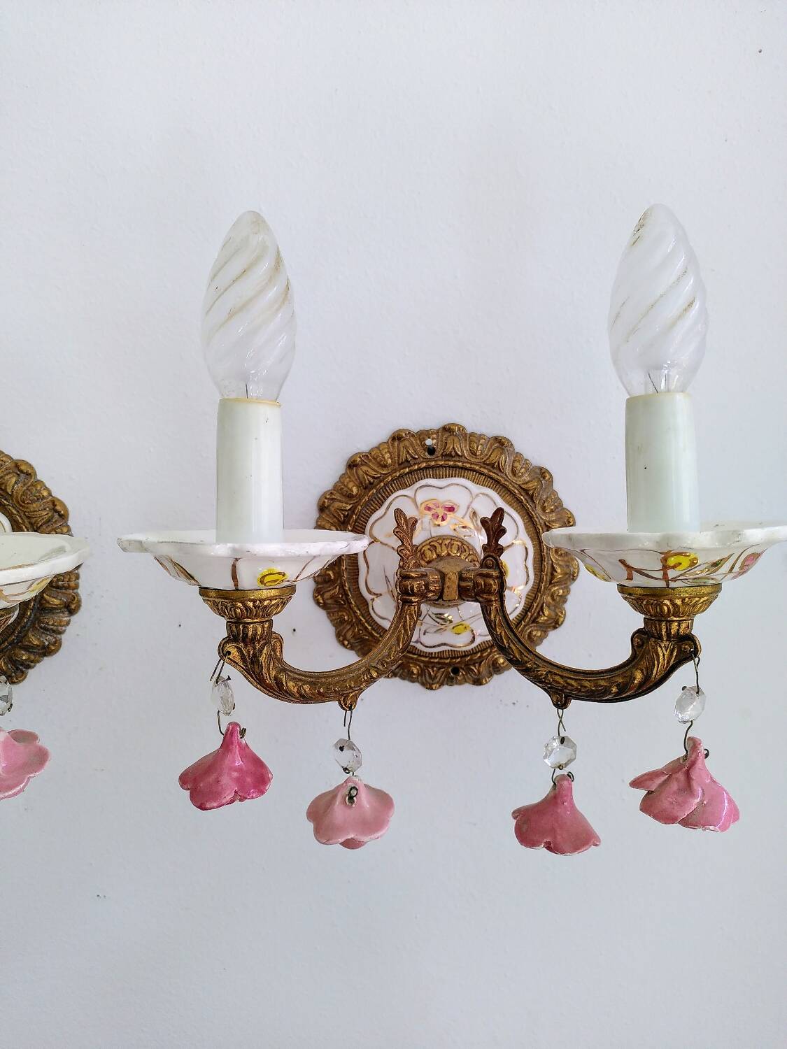 Pair of brass and porcelain wall lights