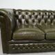 Three-seater green leather Chesterfield sofa