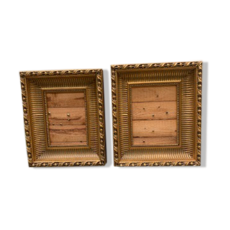 Frames mixed with gilded stucco, raw wood boards