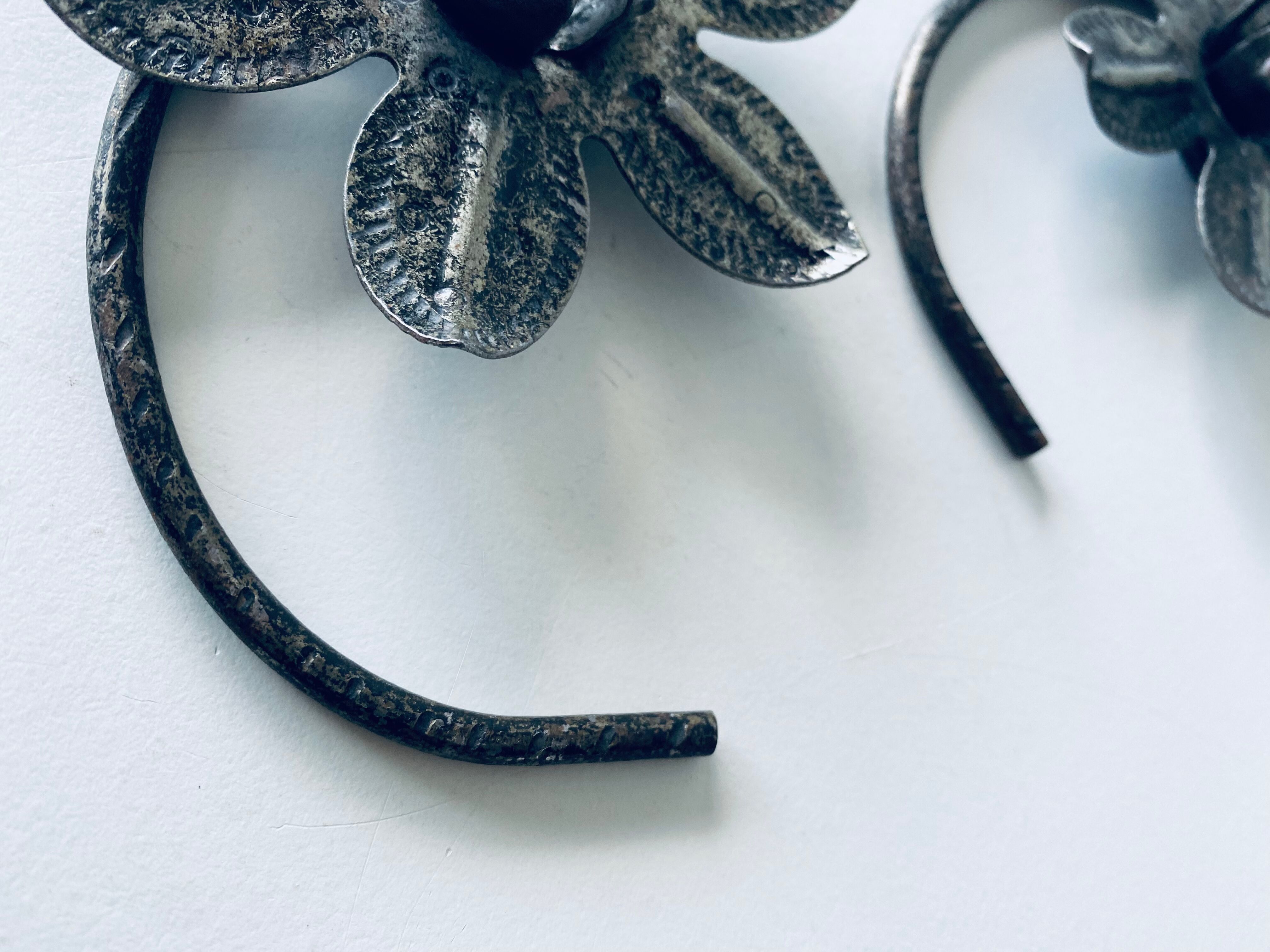 Pair of iron water lily candle holders