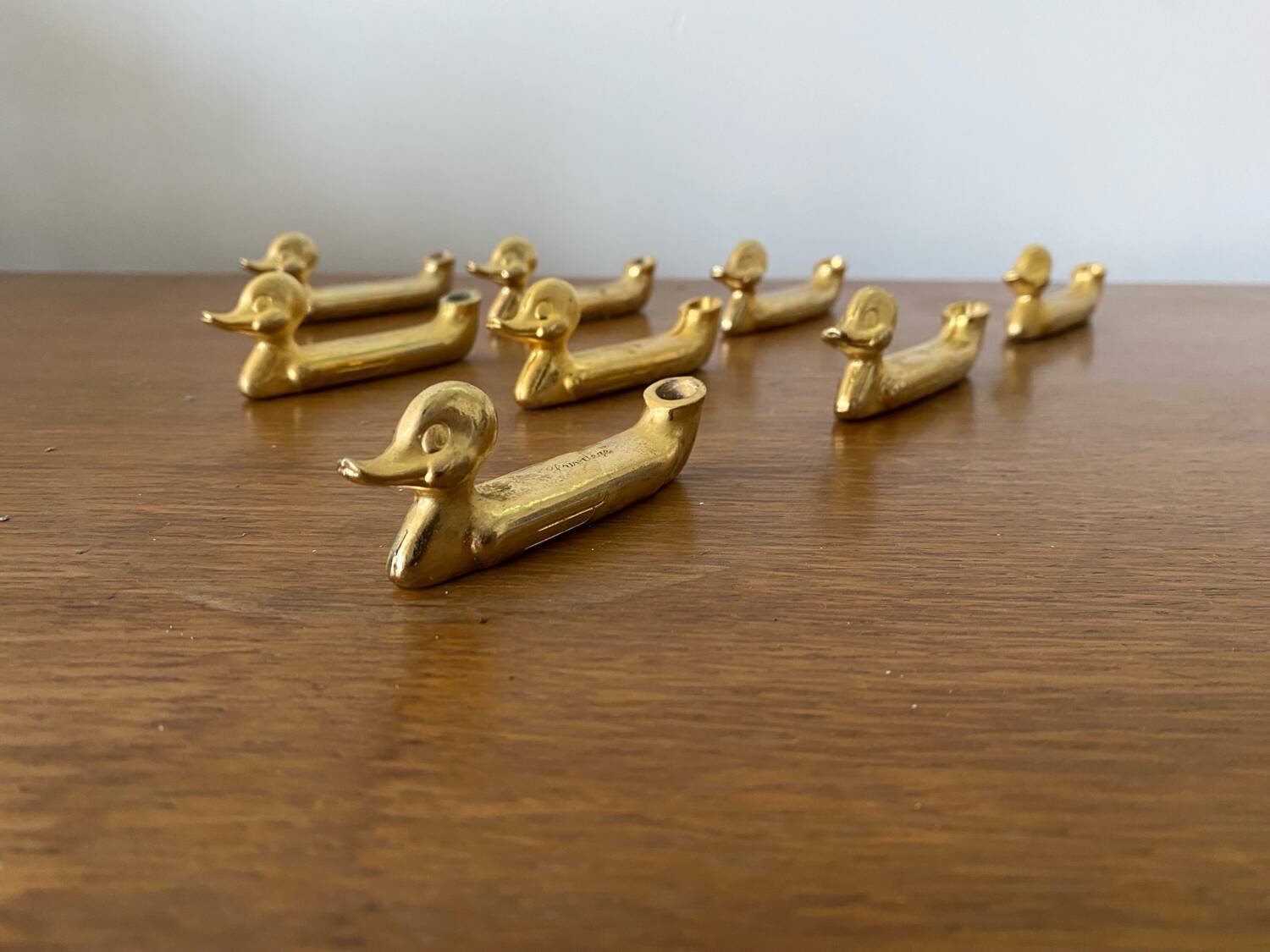 Set of 8 antique privilege knife holders gold metal duck vintage