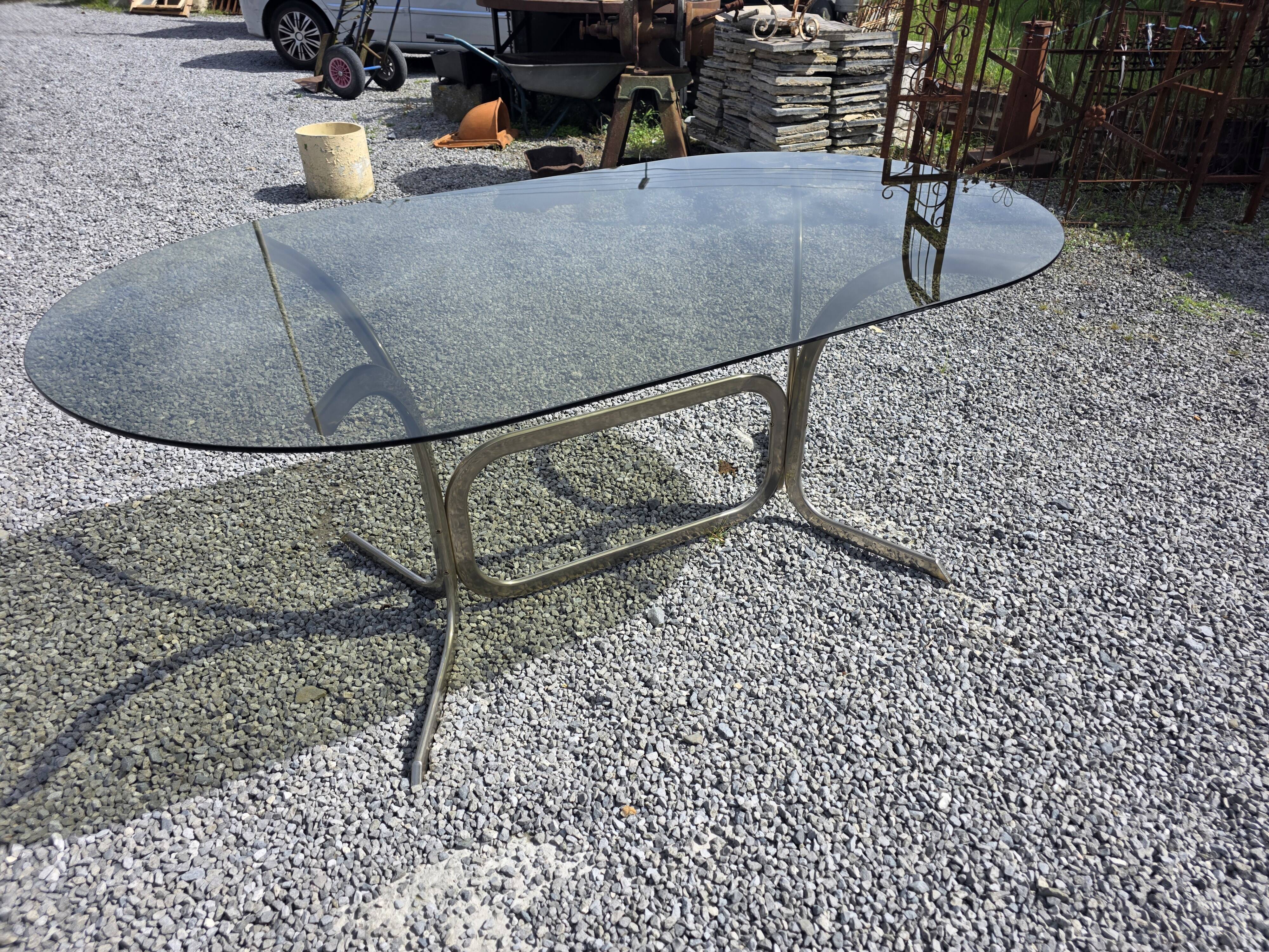Silver metal table with smoked glass top from the 1970s.