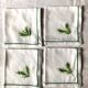 Series of four embroidered linen napkins