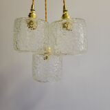 Trio of scrambled glass pendant lamps