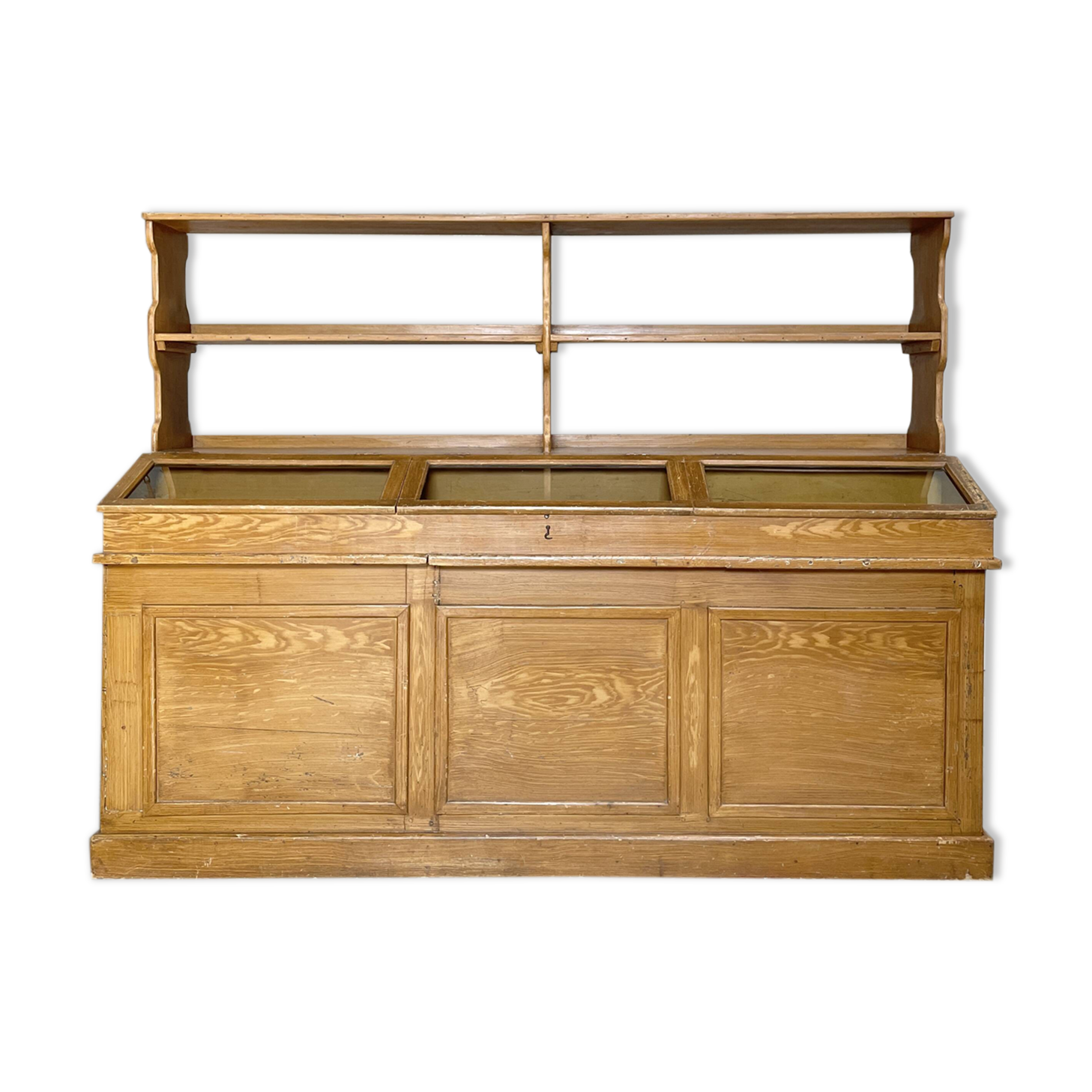 Wooden hardware cabinet painted with wood effect, circa 1940.