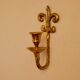 A pair of antique brass wall sconces.