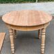 Round extendable dining table stripped in solid cherry wood France 1950